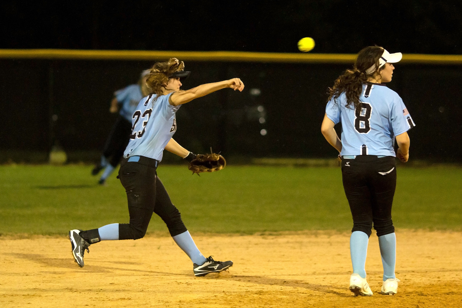Kiley Hennessey makes the throw to first on a ground ball.